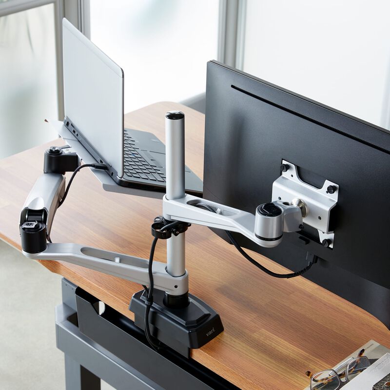 Overhead view of Monitor Arm + Laptop Stand mounted to desk with one monitor and laptop image number null