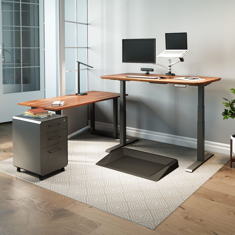 vari electric standing desk, table, and accessories in home office image number null